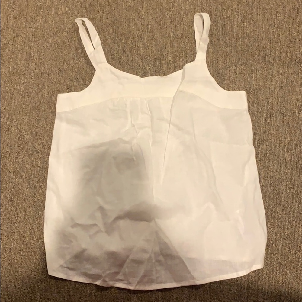 Sleeveless white blouse